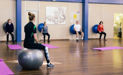 Renee Weller runs a fitball class.